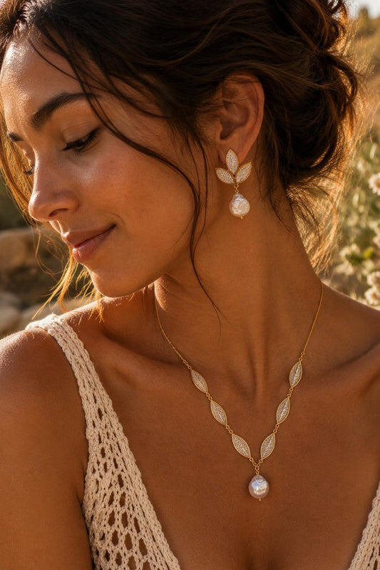 Leaves Statement Necklace with gold filigree leaf charms and baroque pearl pendant